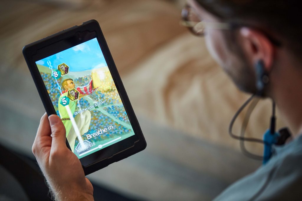 BfB Labs of Macclesfield will soon be launching a a new game using Emotionally Responsive Gaming (ERG) players wear a small ear-clip (BfB Sensor), which measures vital life signs such as heart rate, pulse and breathing. Pictured friends playing the game on their tables